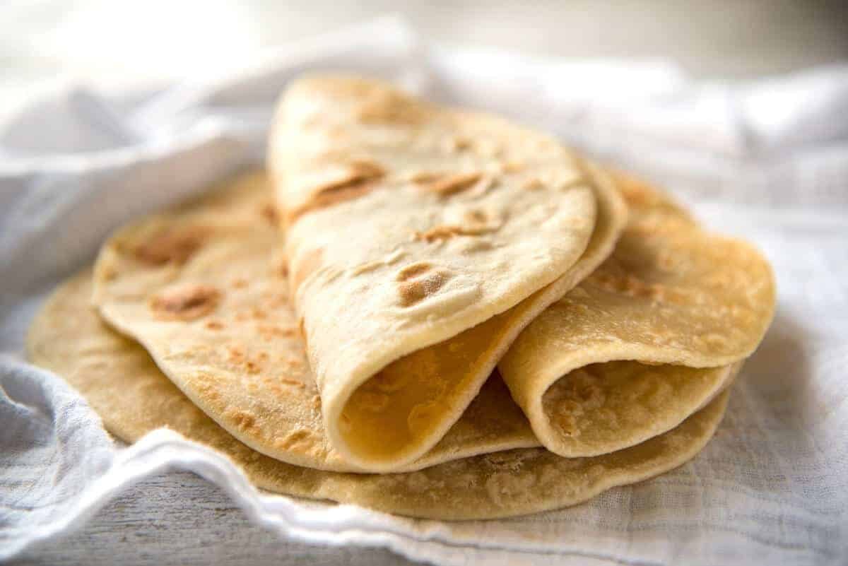 This flatbread recipe is made without yeast, yet is soft and pliable and wonderfully moist. recipetineats.com