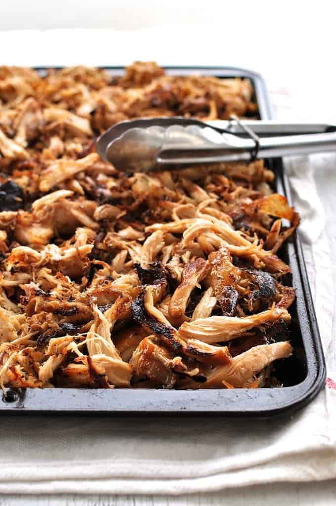 Crispy Chinese Shredded Chicken on a tray, fresh out from under the broiler.