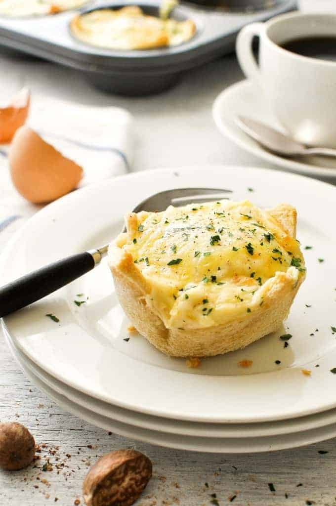 Muffin Tin Breakfast Croque Madame Toastie Cup on a white plate ready to be eaten.