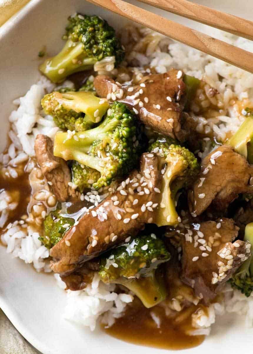 Chinese Beef and Broccoli in rice in a bowl, ready to be eaten.