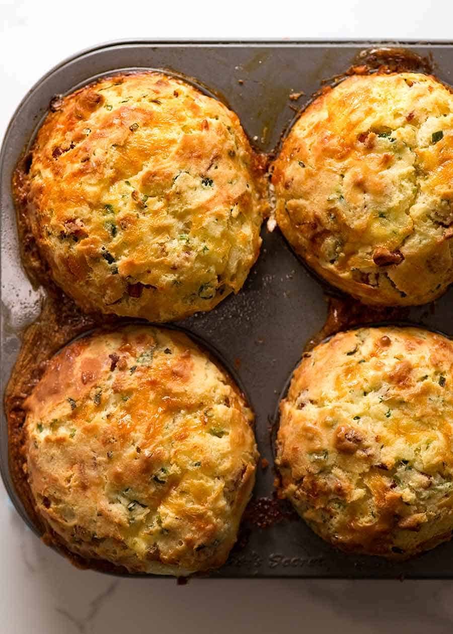 Overhead photo of Bacon Egg Breakfast Muffins in muffin tin, fresh out of the oven