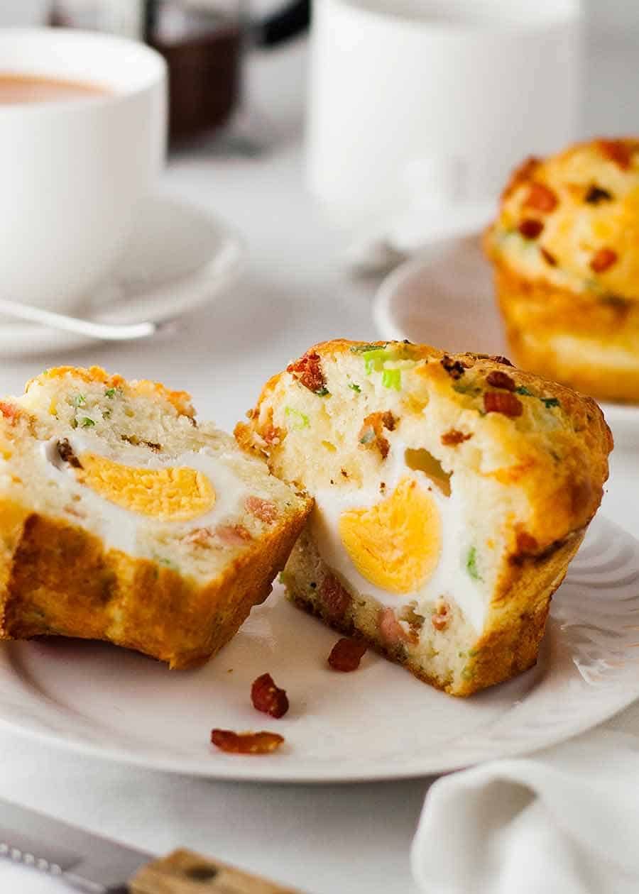 Plate with Bacon Egg Muffin cut open to show whole egg cooked inside