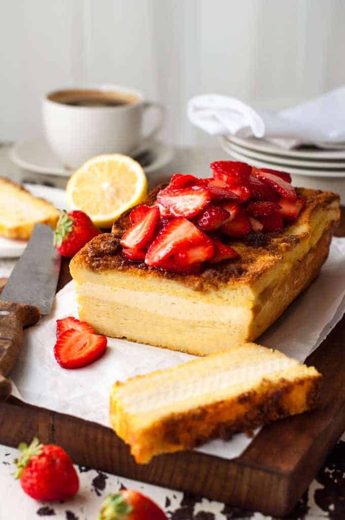 Cream Cheese Stuffed French Toast Loaf topped with strawberries