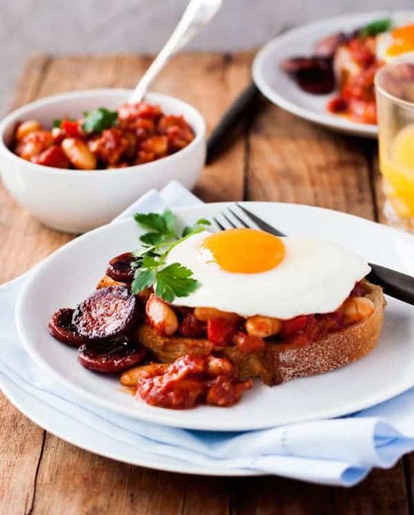 Chorizo Baked Beans on Toast topped with a fried egg