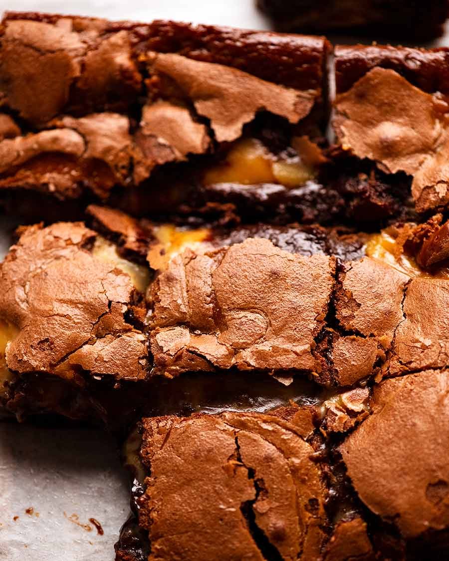 Caramel Brownies cut into slices ready to be eaten