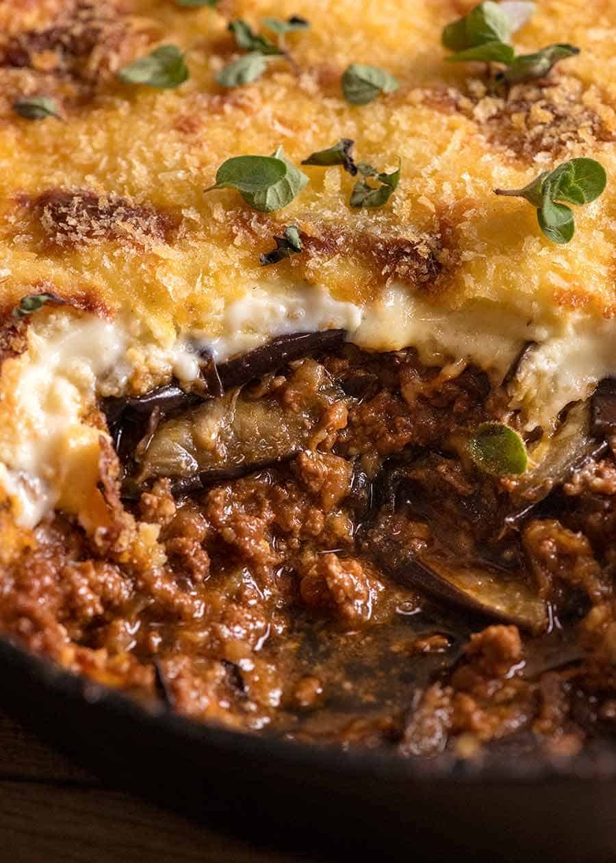 Close up photo of Moussaka showing the layers of eggplant, meat sauce and bechamel sauce