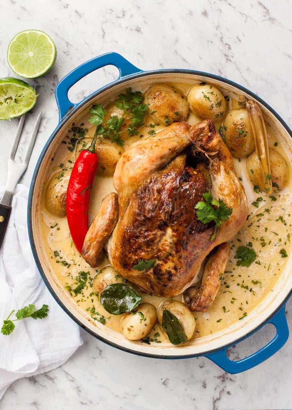 Whole pot roasted chicken in fragrant coconut broth