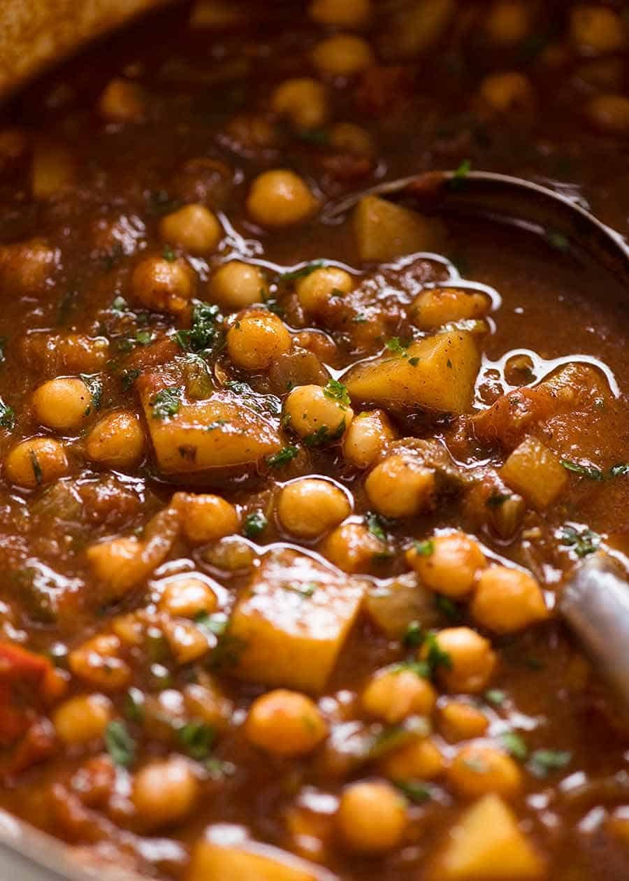 Close up of Chickpea Curry (Chana Aloo) in a pot, ready to be served