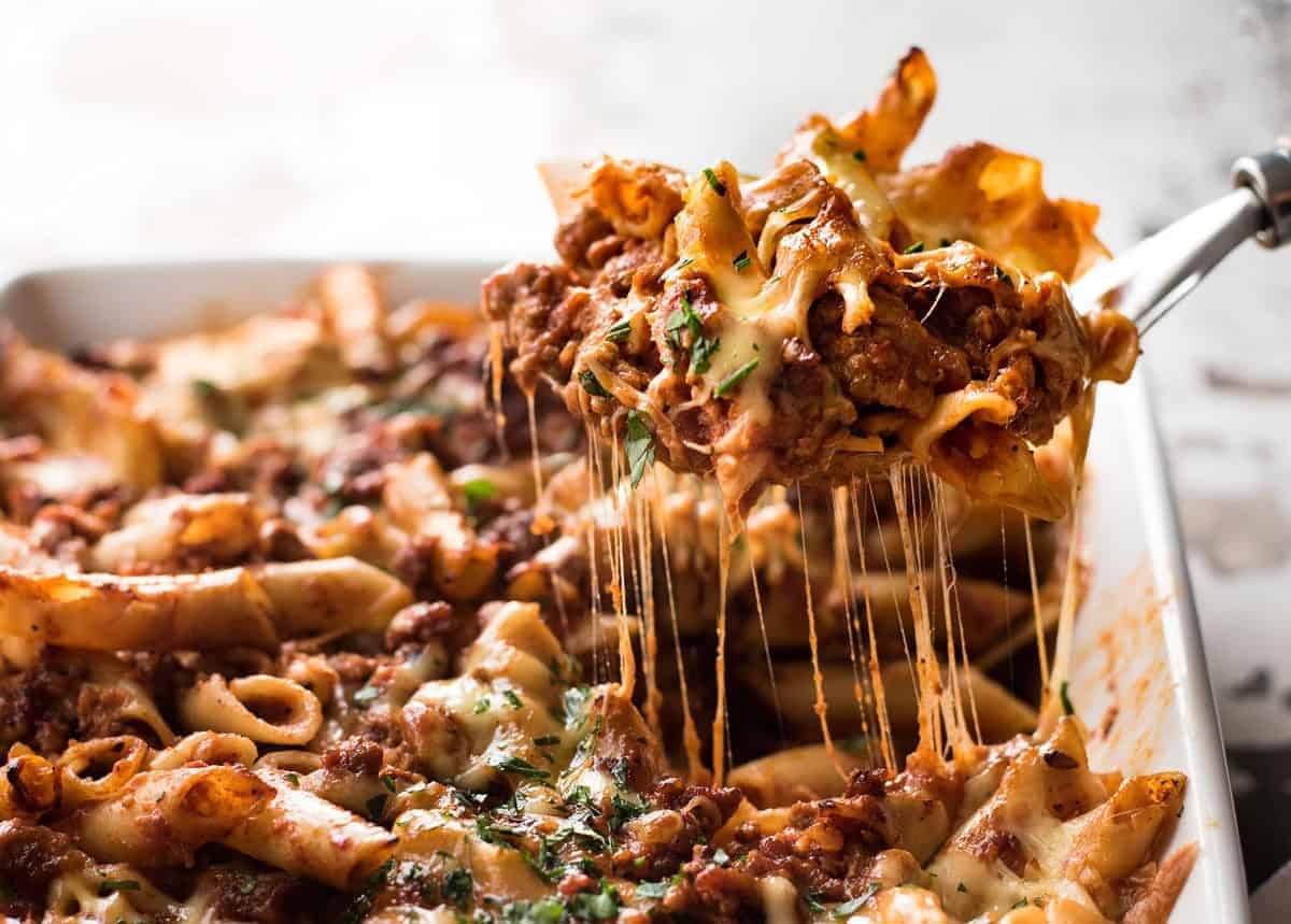 A slice of lasagne being lifted