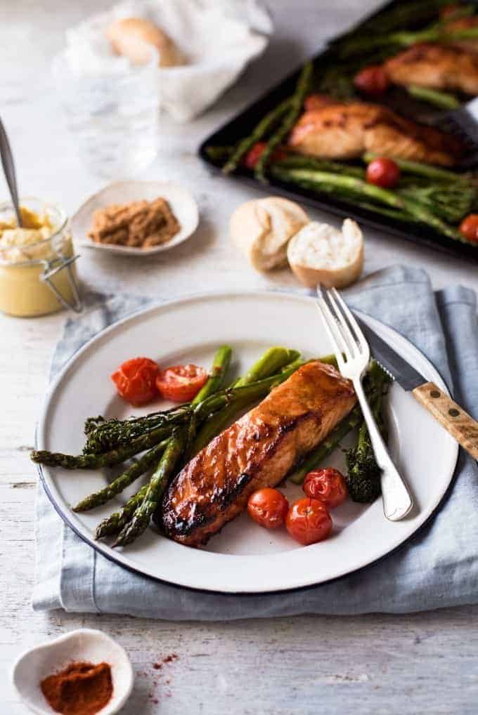 Table setting with Spicy Brown Sugar Salmon, bread and mustard