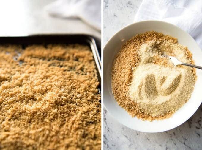 A tray with golden toasted panko breadcrumbs and a bowl with parmesan mixed with breadcrumbs.