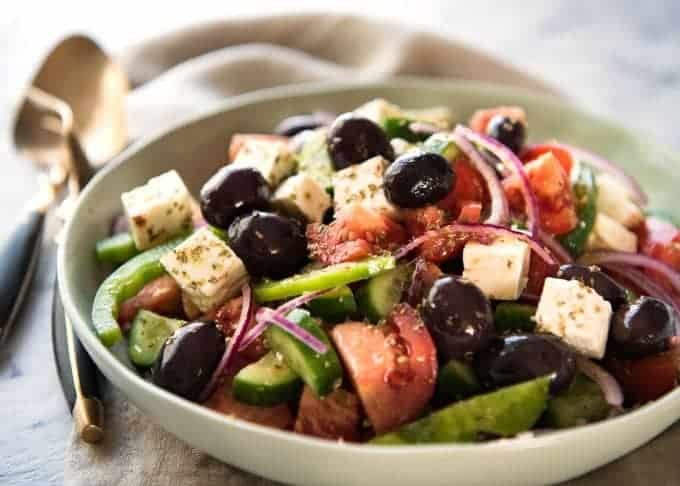A classic Greek Salad with plump olives and a beautiful homemade Greek Salad Dressing. recipetineats.com