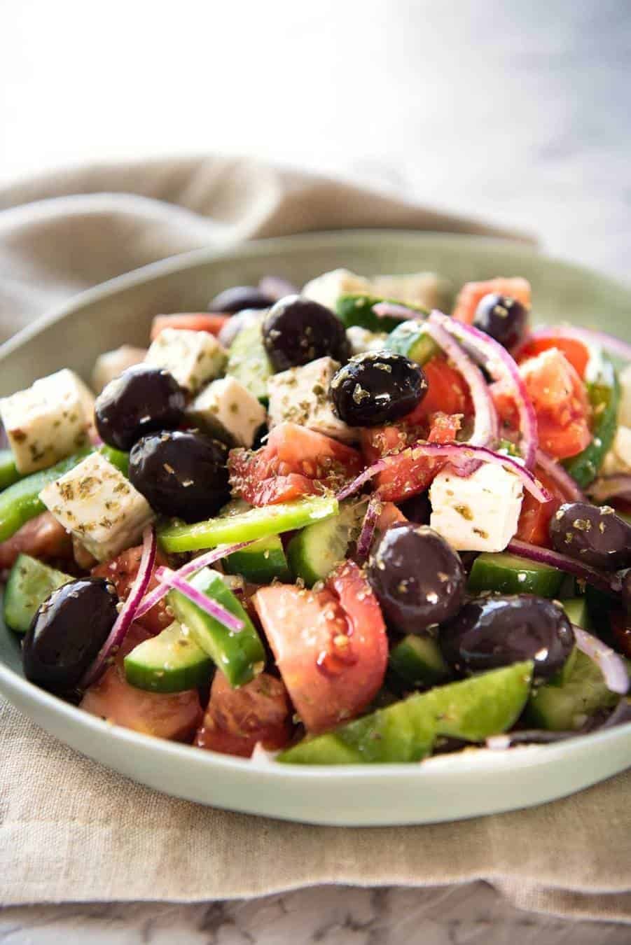 A classic Greek Salad with plump olives and a beautiful homemade Greek Salad Dressing. www.recipetineats.com