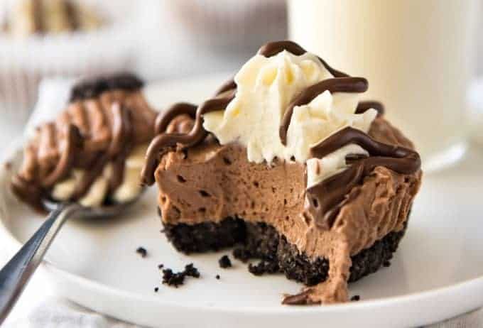 No Bake Nutella Cheesecake - Mini ones made in a muffin tin! A biscuit base and light mousse-like Nutella flavoured cheesecake. Easy to make and completely irresistible! recipetineats.com