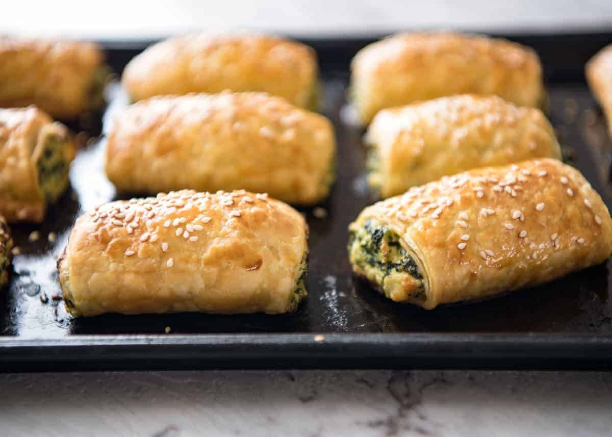 Spinach and Ricotta Rolls - a moist cheesy filling enclosed with buttery flaky puff pastry. Great make ahead for freezing! www.recipetineats.com