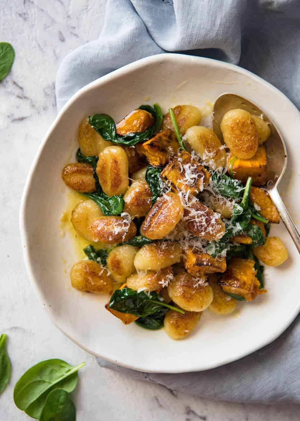 Pan Fried Gnocchi with Pumpkin and Spinach - Golden crispy on the outside, soft on the inside, with a butter sage sauce, roasted pumpkin and spinach. www.recipetineats.com