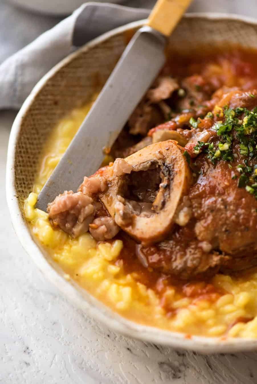 Fork tender veal braised in a rich red sauce, Osso Buco is a meal fit for a king! www.recipetineats.com