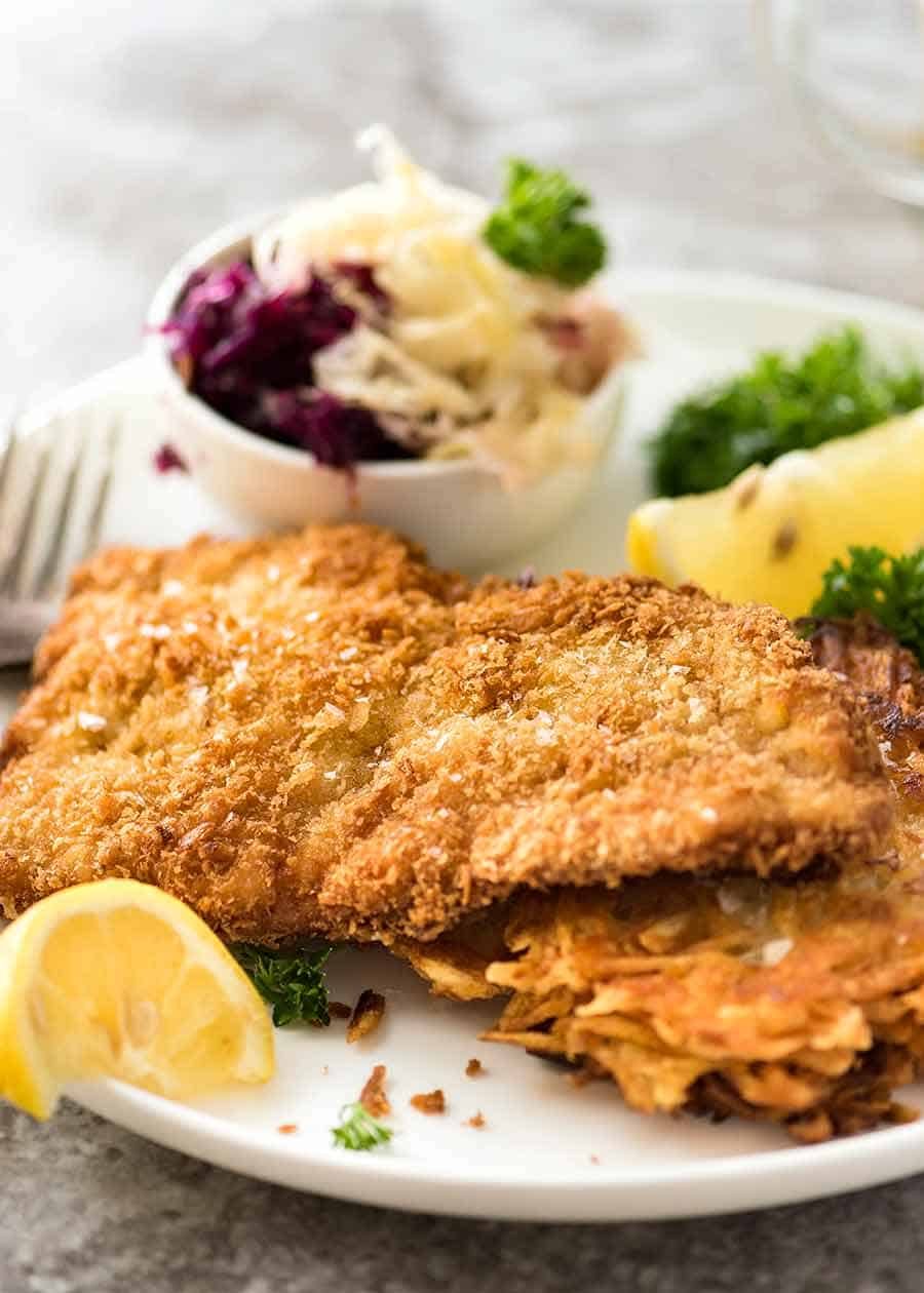 Close up of Schnitzel on a plate with crispy potato rosti