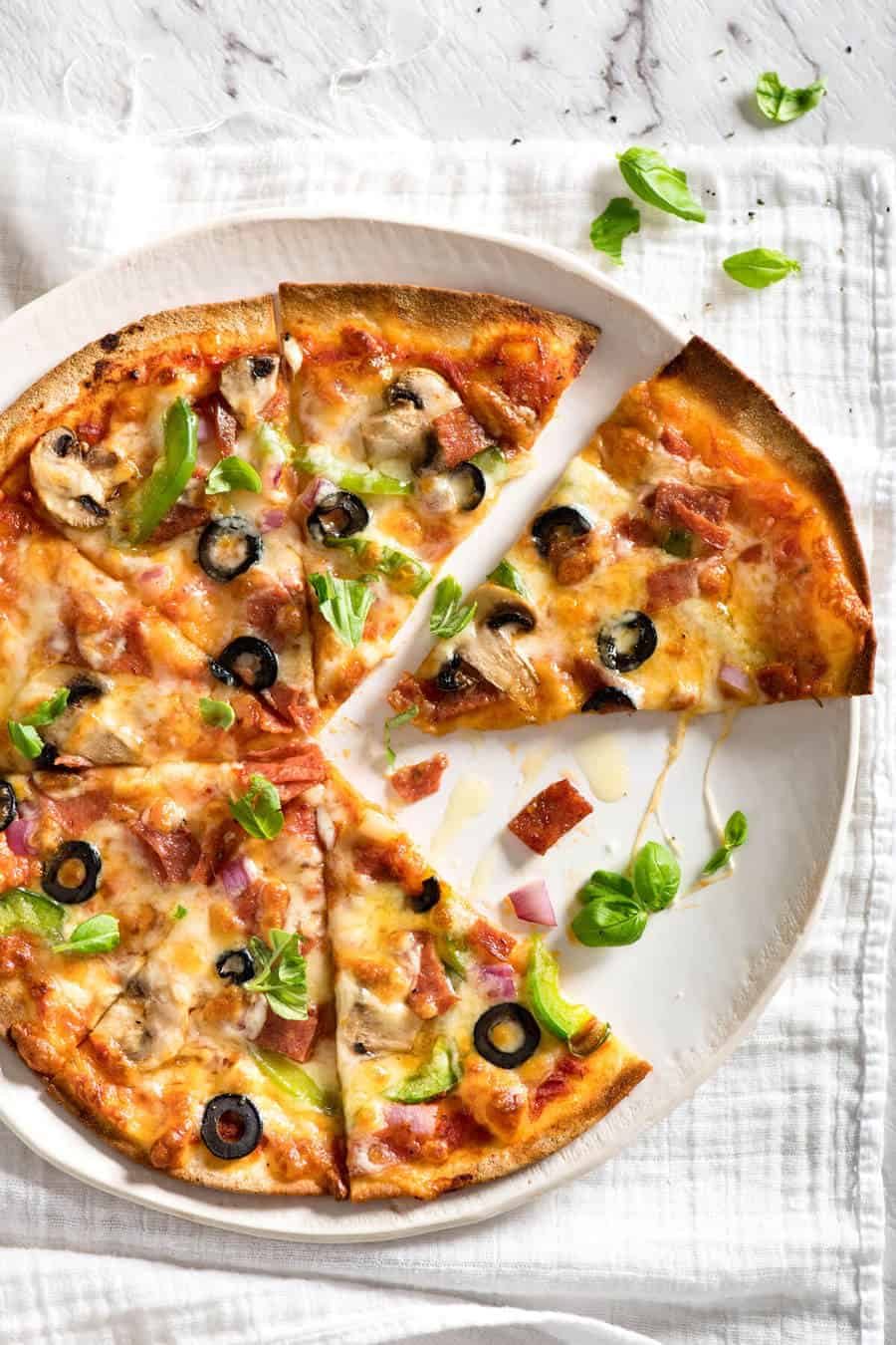 $2 Homemade Frozen Pizzas - quick and easy made using flatbreads, cook from frozen for a terrific Thin & Crispy pizza! www.recipetineats.com