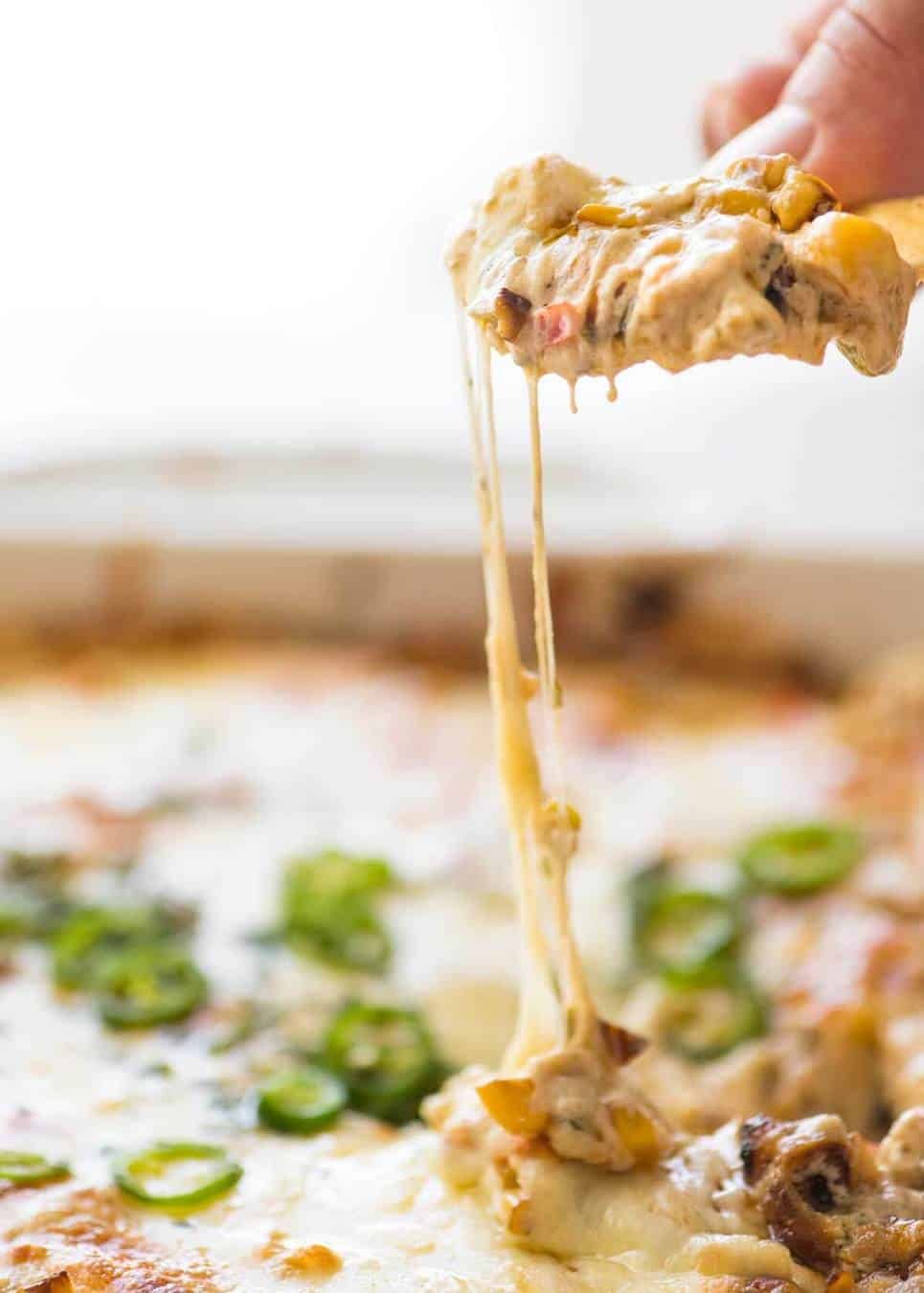 Essential Super Bowl food - a big batch Hot Corn Dip that's made for eating with eyes glued to the TV screen.