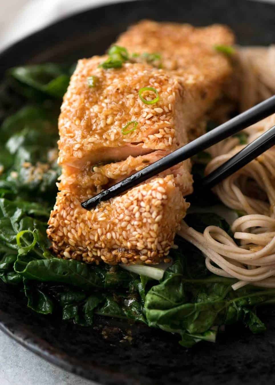 Just roll the salmon in sesame seeds, drizzle with oil and bake! You'll be amazed how well the sesame adheres to the salmon and love how crispy this Sesame Salmon comes out!