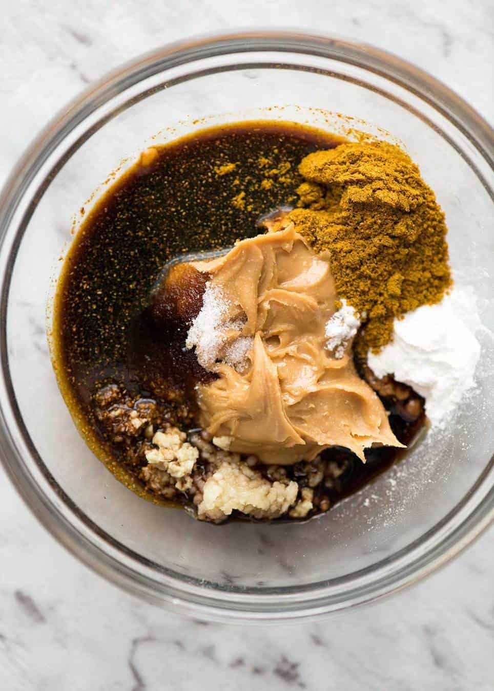 Ingredients for Satay Sauce for stir fries in a bowl, ready to be mixed