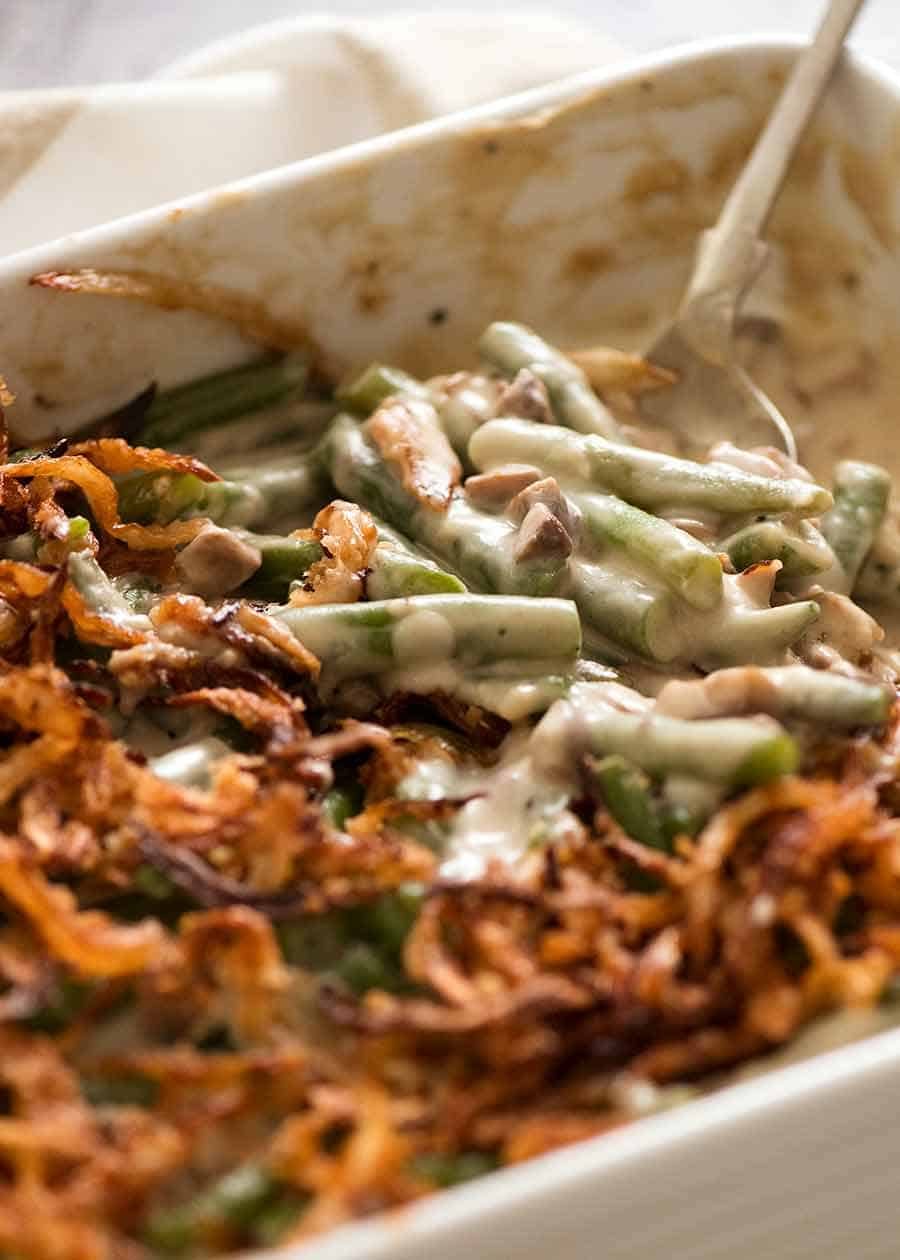 Close up of Green Bean Casserole in a white casserole dish, ready to be served