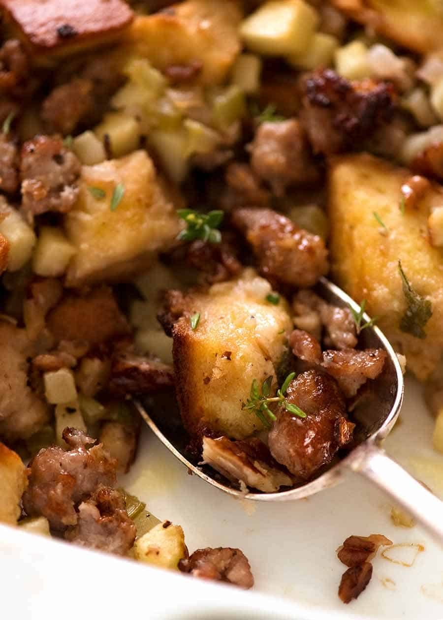 Close up spoon digging into Sausage Stuffing