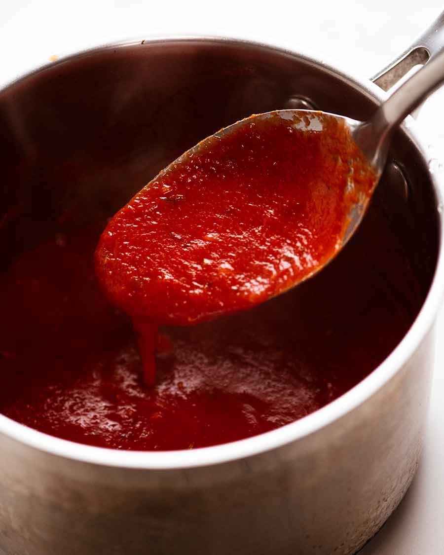 Chicken Parmigiana (Chicken Parmesan) Tomato Sauce in a saucepan