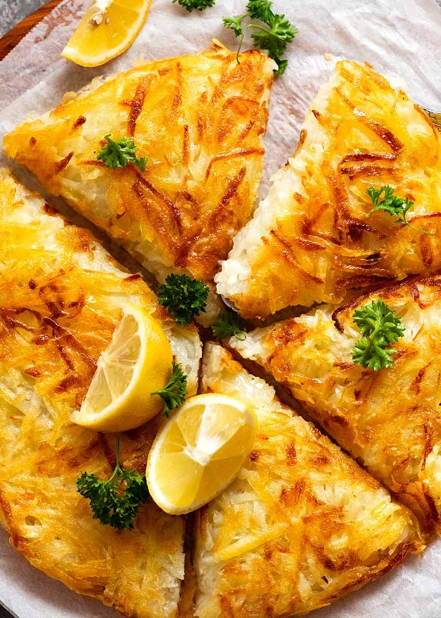 Crispy Giant Potato Rosti cut into wedges, ready to be served