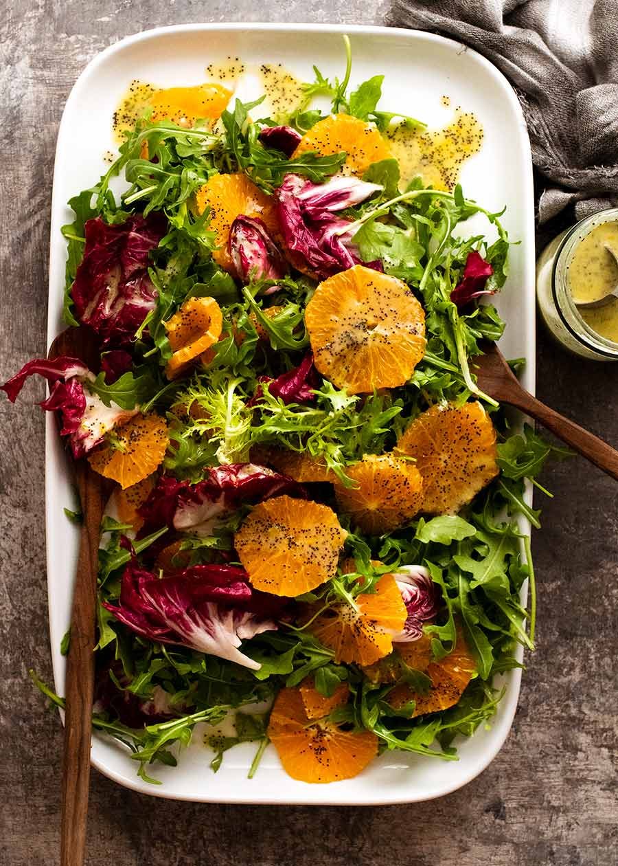 Bitter Leaf and Orange Salad with Orange Poppyseed Dressing on a plate ready to be served