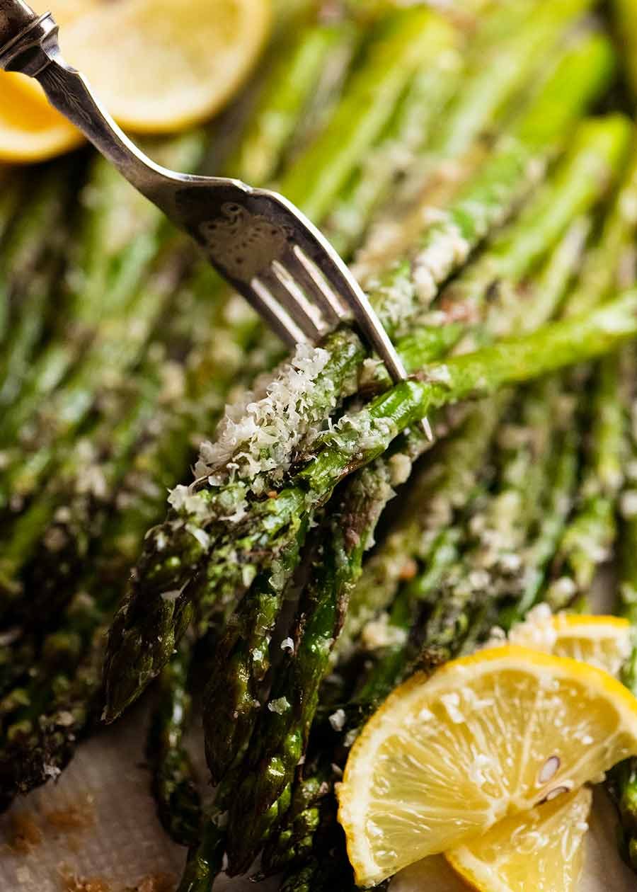 Fork picking up Roasted Asparagus