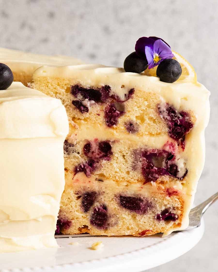Slice of Blueberry Cake with Lemon Cream Cheese Frosting on a plate
