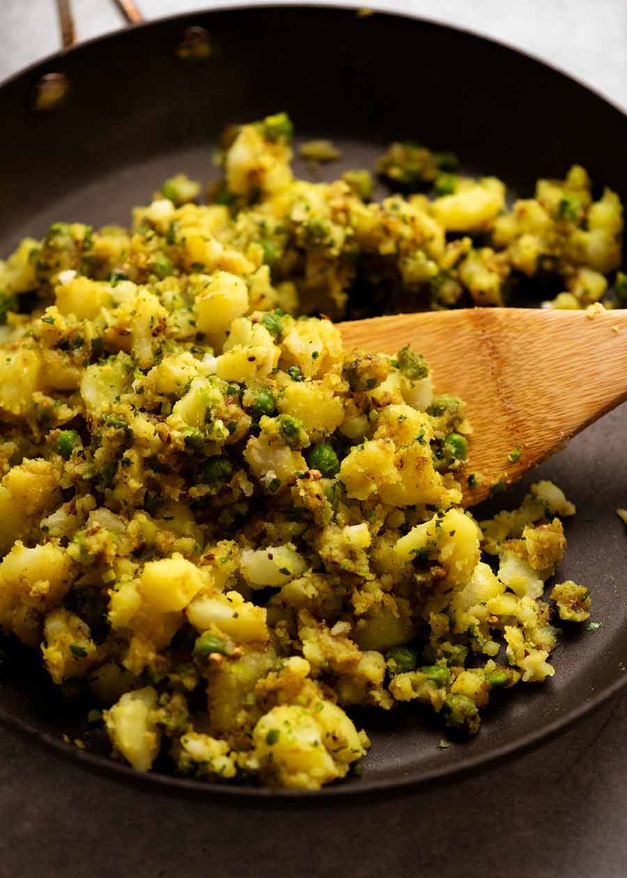 Freshly made Samosa filling in a black skillet