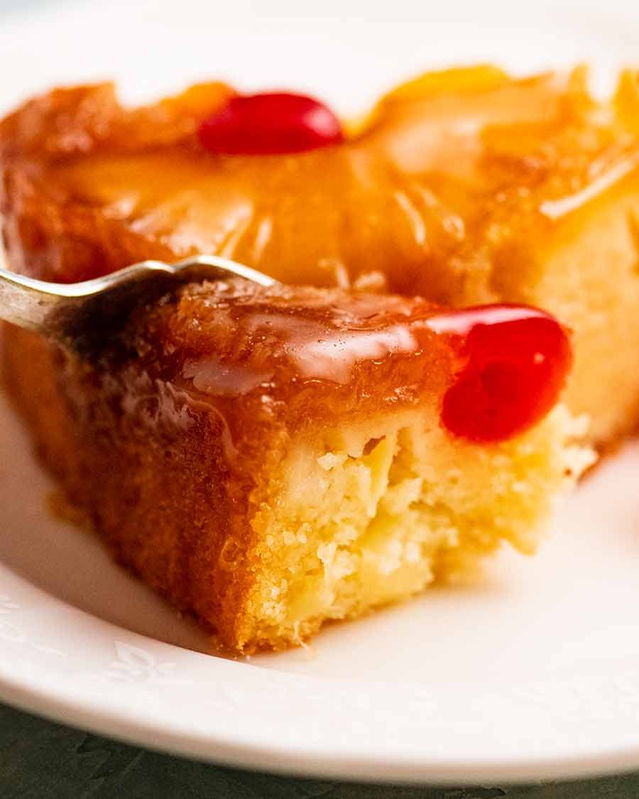 Close up of fork eating Pineapple Upside Down Cake