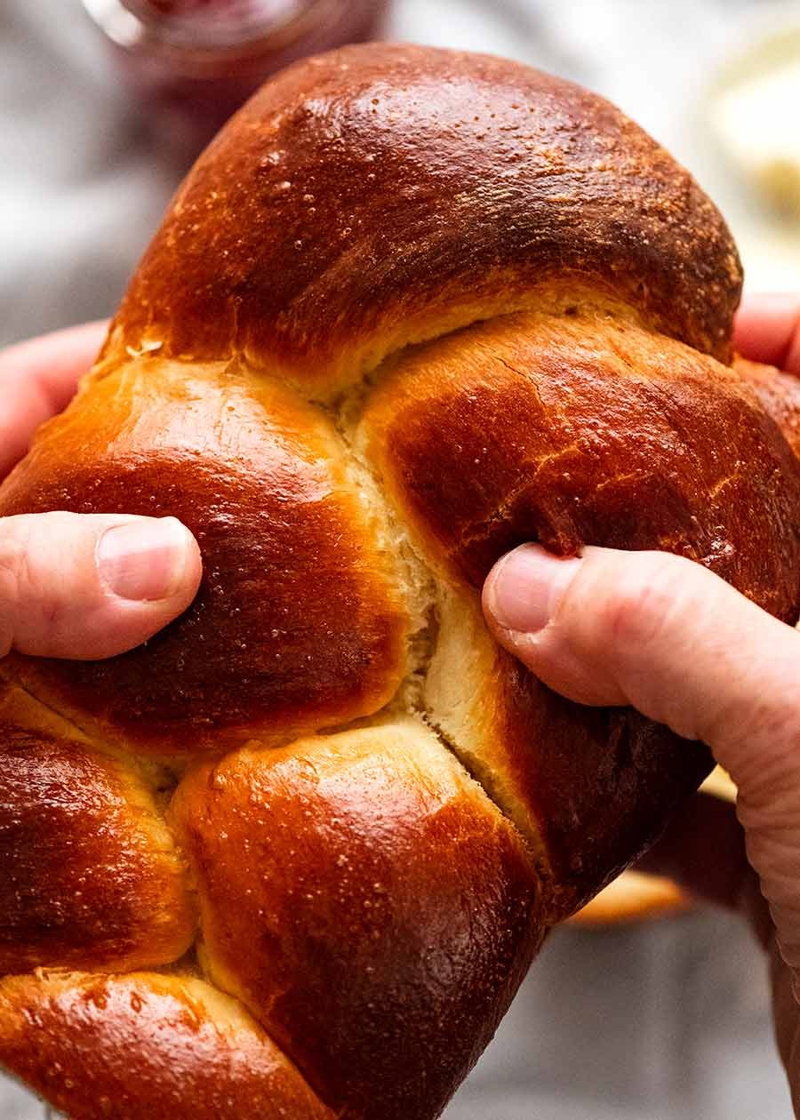 Hands holding Brioche bread