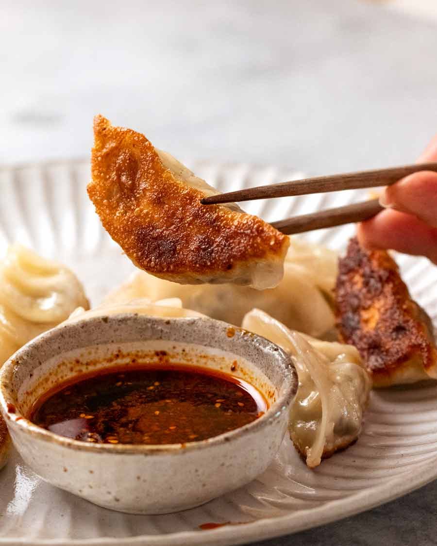 Showing the crispy golden base of pan steamed Vegetable Dumplings (Potstickers)