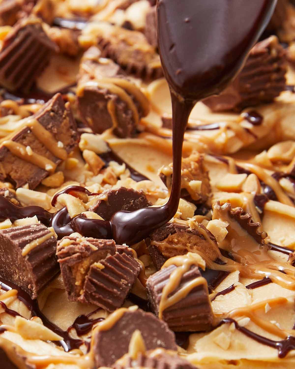 Drizzling chocolate on Chocolate peanut butter cake