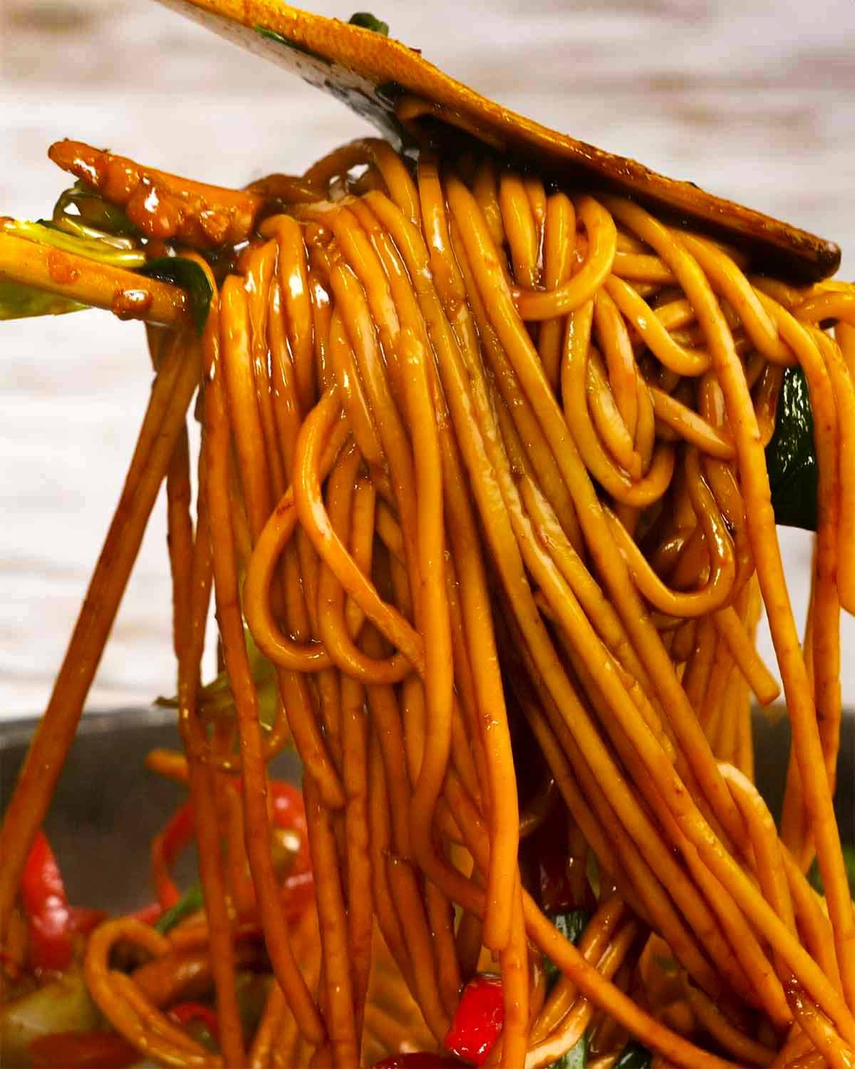 Tossing Hokkien noodles